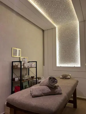 a room with a bed with a large window at Luxe Nomade Marrakech & Spa in Marrakech