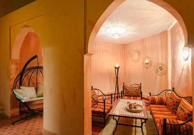 a living room with a couch and a table at The Grand Medina Hideaway - Marrakech Centre in Marrakech