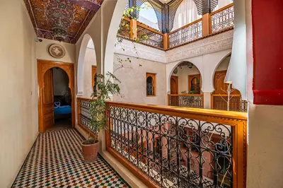 a hallway of a house with a balcony at Riad N 15 Zefriti in Marrakech