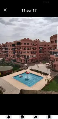 a picture of a large building with a swimming pool at premium village 106 in Marrakech