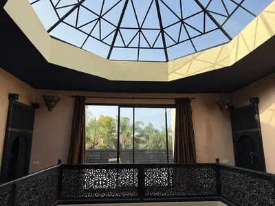 a view from the balcony of a building with a glass ceiling at Villa Jude in Marrakech