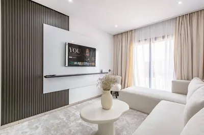 a living room with a couch and a table at Brand New! Charming and Comfortable Flat in Gueliz in Marrakech