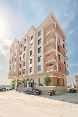 a large building with a car parked in front of it at New ! Logement Chic, Emplacement Idéal in Marrakech