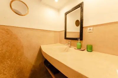 a bathroom with a sink and a mirror at Riad Rouge Gorge in Marrakech