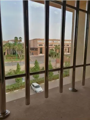 a view of a white car through a window at Appartement de rêve à Marrakech in Marrakech