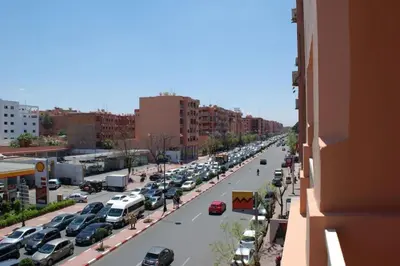 a city street filled with lots of parked cars at Residence Miramas 2 D in Marrakech