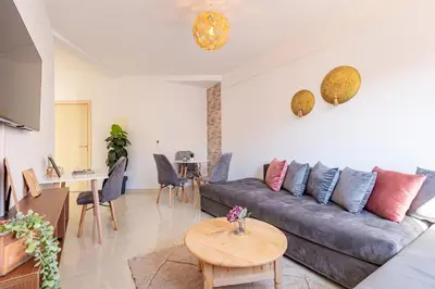 a living room with a couch and a table at Marrakech kamed home in Marrakech