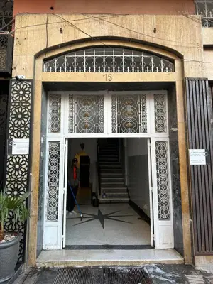 a person walking through a doorway of a building at Gueliz Center Home (Starbucks) in Marrakech