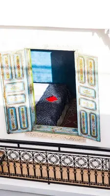 a model of a bed in a doll house at Riad Afous in Marrakech