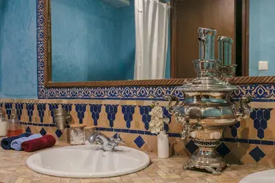 a bathroom with a sink and a mirror at Gueliz Gala – Marrakech Centre in Marrakech