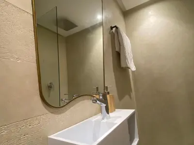 a bathroom with a sink and a mirror at Rooftop Pool, Atlas View, M avenue in Marrakech