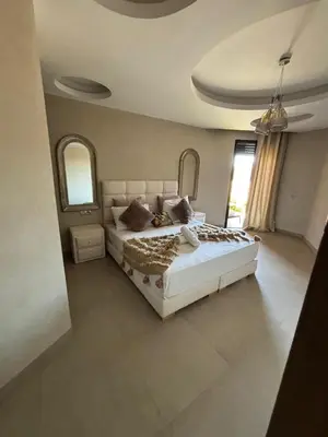 a bedroom with a large bed in a room at Appartement neuf climatisé, centre Marrakech. in Marrakech