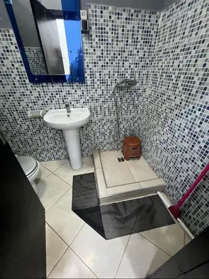 a bathroom with a sink and a toilet at Lucky Nest apartment À Bassatine targa Marrakech à proximité de Hammam Zinaya in Marrakech
