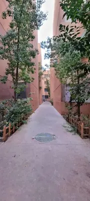 an empty alley with a manhole in a building at Lucky Nest apartment À Bassatine targa Marrakech à proximité de Hammam Zinaya in Marrakech