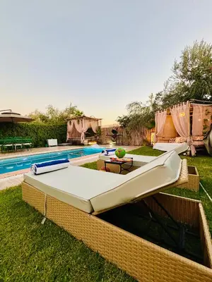 a swimming pool with avertisement for avertisementosateosateosateosateosateosateosate at Private Villa BSF - Pool & Spa - Palm Golf in Marrakech