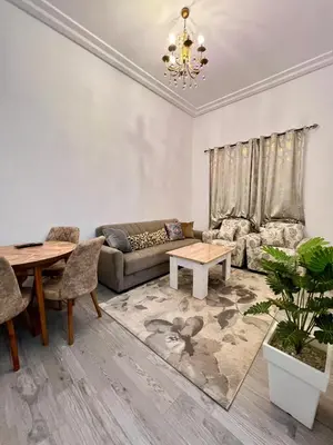 a living room with a couch and a table at MyZo Superbe Appartement familial bien situé à Marrakech in Marrakech