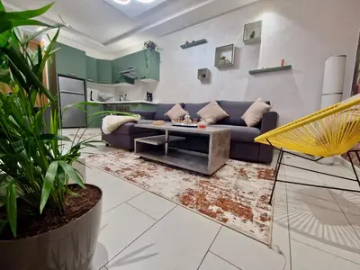 a living room with a couch and a table at Marrakeschzentrum Hideaway in Marrakech