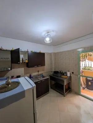 a kitchen with a sink and a stove at Angel Appartement in Marrakech
