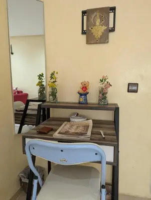 a dressing table with a mirror and a table with a mirror at Angel Appartement in Marrakech