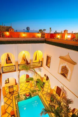 an overhead view of a building with a swimming pool at RIAD ELNOUJOUM in Marrakech