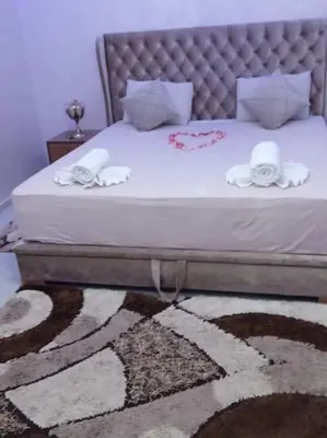 a bedroom with a bed and a rug with a bed sqor at Private Villa with private Chef optional in Marrakech