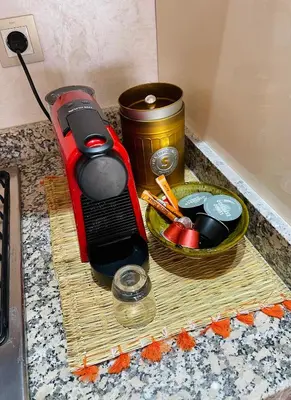 a toaster on a counter next to a bowl of food at Pearl Garden Studio Cozy Panoramic Charming sunny Terrace Piscine in Marrakech