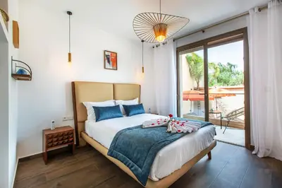 a bedroom with a bed and a large window at Villa Serenity & SPA - Breakfast in Marrakech