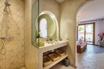 a bathroom with a sink and a mirror at Villa Serenity & SPA - Breakfast in Marrakech