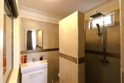 a bathroom with a sink and a shower at Riad avec piscine - Wifi- petit déjeuner - Bon Emplacement in Marrakech
