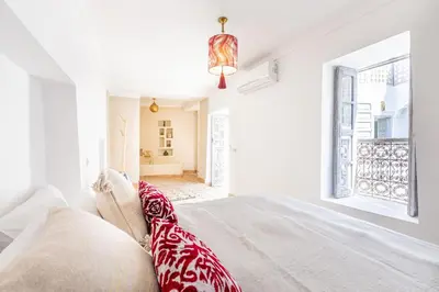 a bedroom with a bed and a window at Riad Itri (إتري) Exclusif - Marrocan Breakfast in Marrakech