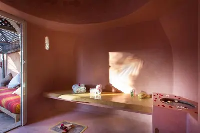 a room with a bed in a room with a window at Riad Jnan El Cadi in Marrakech