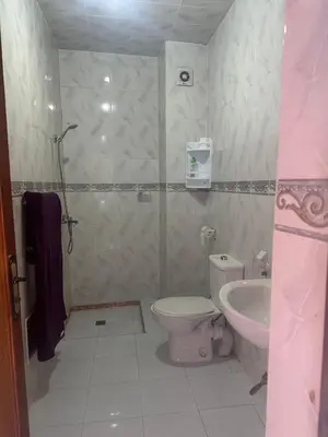 a bathroom with a toilet and a sink at Stylish Moroccan Apartment Near Marrakech Airport in Marrakech