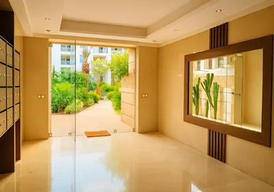 a hallway with a glass door leading to a garden at Pearl Garden 69 in Marrakech