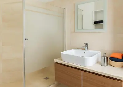 a bathroom with a white sink and a shower at Pearl Garden 69 in Marrakech