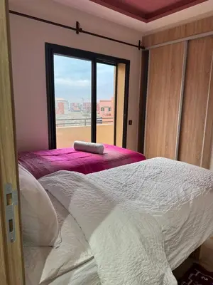 a bedroom with a large bed with a window at A1, Central, Old-City 7Min on feet, good equipped in Geliz, Bab-Dokala, Majorelle, No taxi needed in Marrakech