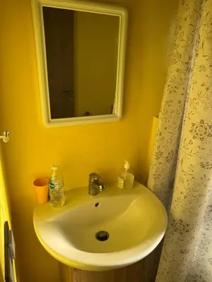 a bathroom with a white sink and a mirror at A1, Central, Old-City 7Min on feet, good equipped in Geliz, Bab-Dokala, Majorelle, No taxi needed in Marrakech