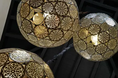 two large gold and white plates with designs on them at Villa Jennabelle in Marrakech
