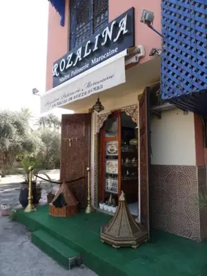 a store with a sign on the side of a building at Manis Apartment Set in a Hotel Area in Marrakech