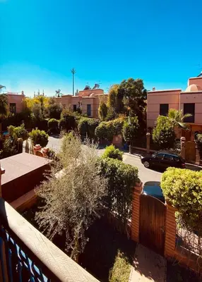 a view from a balcony of a parking lot at Villa Talmoulkt Familiale in Marrakech