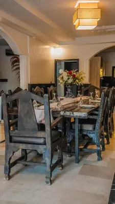 a dining room with a table and some chairs at Luxury heated pool Villa Marrakech in Marrakech