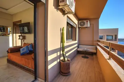 a room with a bed and a cactus at Nour 5 el bellar in Marrakech