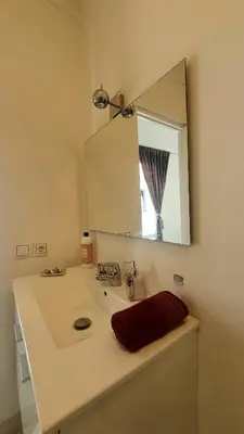 a bathroom with a sink and a mirror at Riad VIP Bed & Breakfast in Marrakech