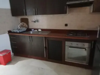 a kitchen with a sink and a stove at Nic's apartment in Marrakech