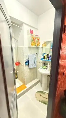 a small bathroom with a sink and a toilet at WOLFY’s Apartment in Marrakech