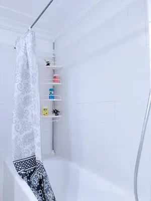 a bathroom with a shower with a shower curtain at Grand Cozy Apartment in Heart of Hivernage in Marrakech