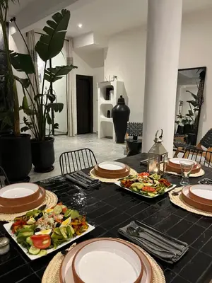 a table with plates of food on top at Riad Dar Belhaj in Marrakech