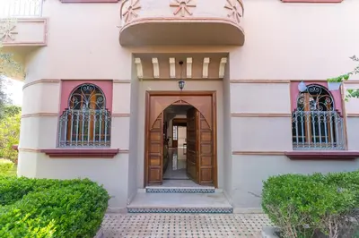 an entry to a building with a wooden door at Royal mirage villa(families only) in Marrakech