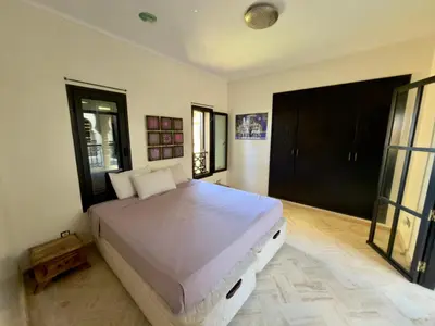 a bedroom with a large bed in a room at Sublime Villa Riad en ville avec piscine in Marrakech
