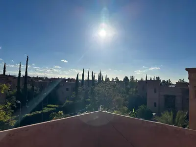 a view of a city from the roof of a building at Sublime Villa Riad en ville avec piscine in Marrakech