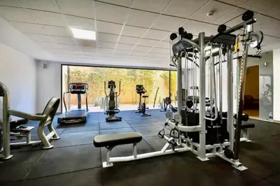 a gym with several tread machines in a room at Luxury living/Terrace/Pool in Marrakech